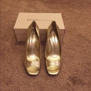 BCBGeneration gold peeptoe heels